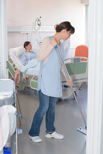 Woman Cleaning Hospital Floor