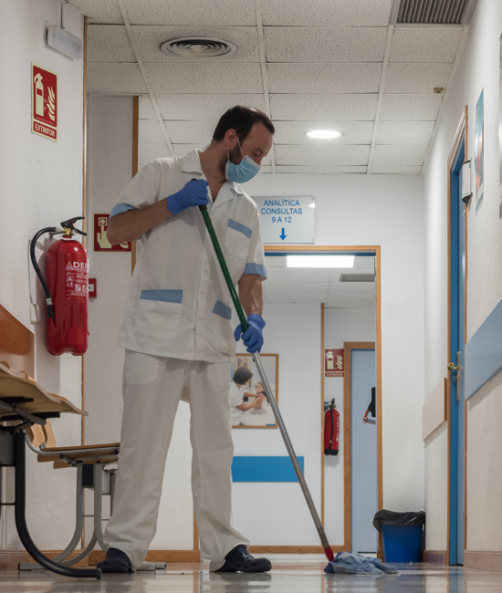 Man Cleaning Hospital Corridor